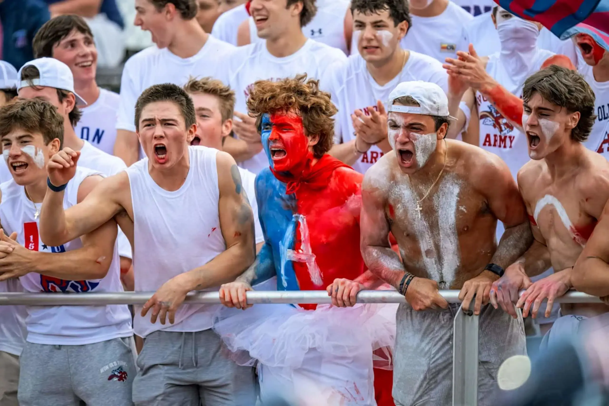 Avon Old Farms students cheering at an athletics event.