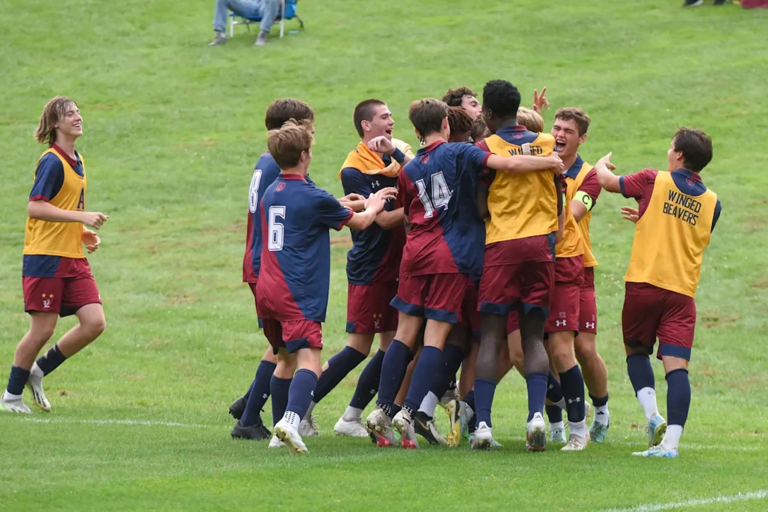 Avon Old Farms Soccer team celebrating.