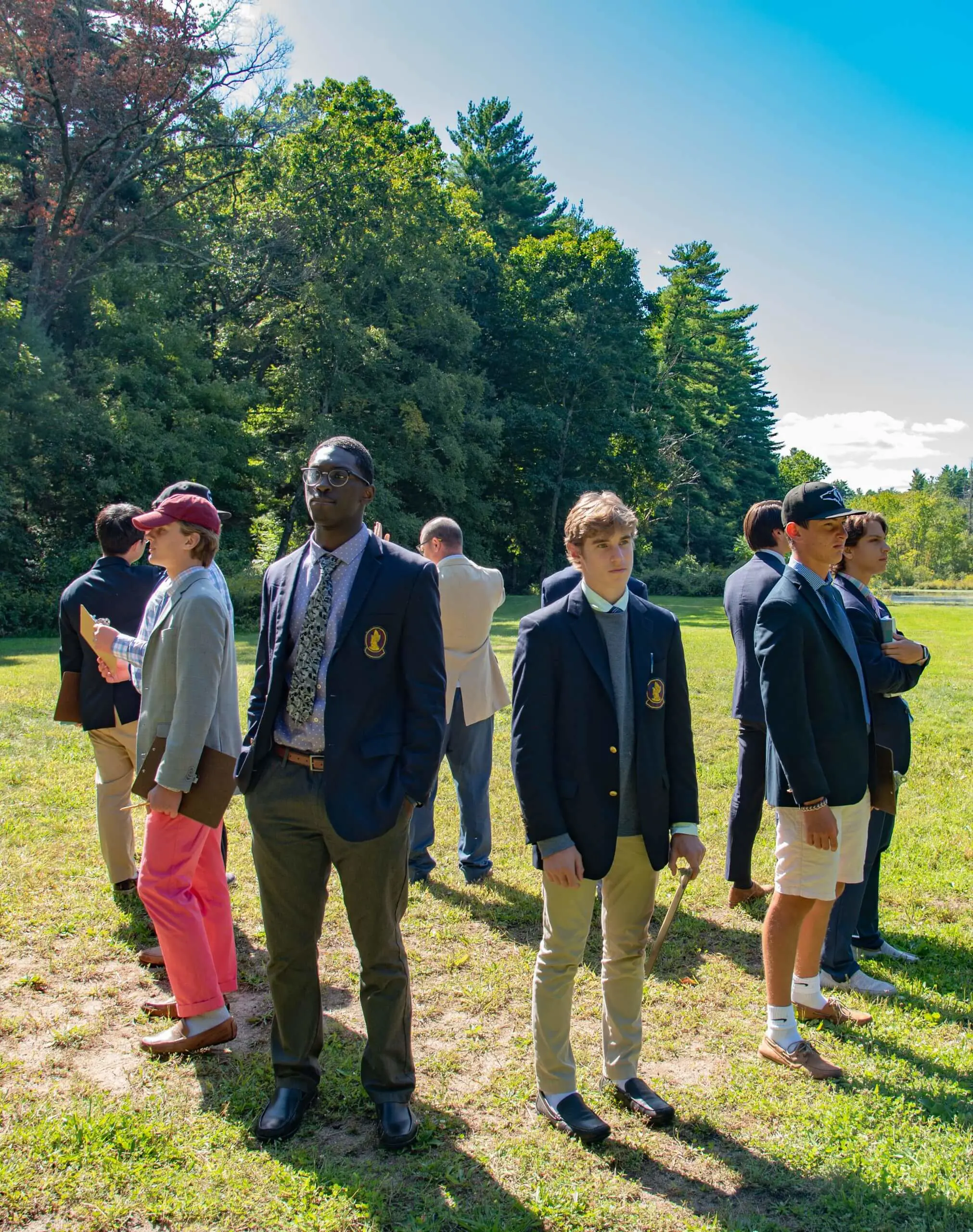 Avon Old Farms standing in a circle at Beaver Pond