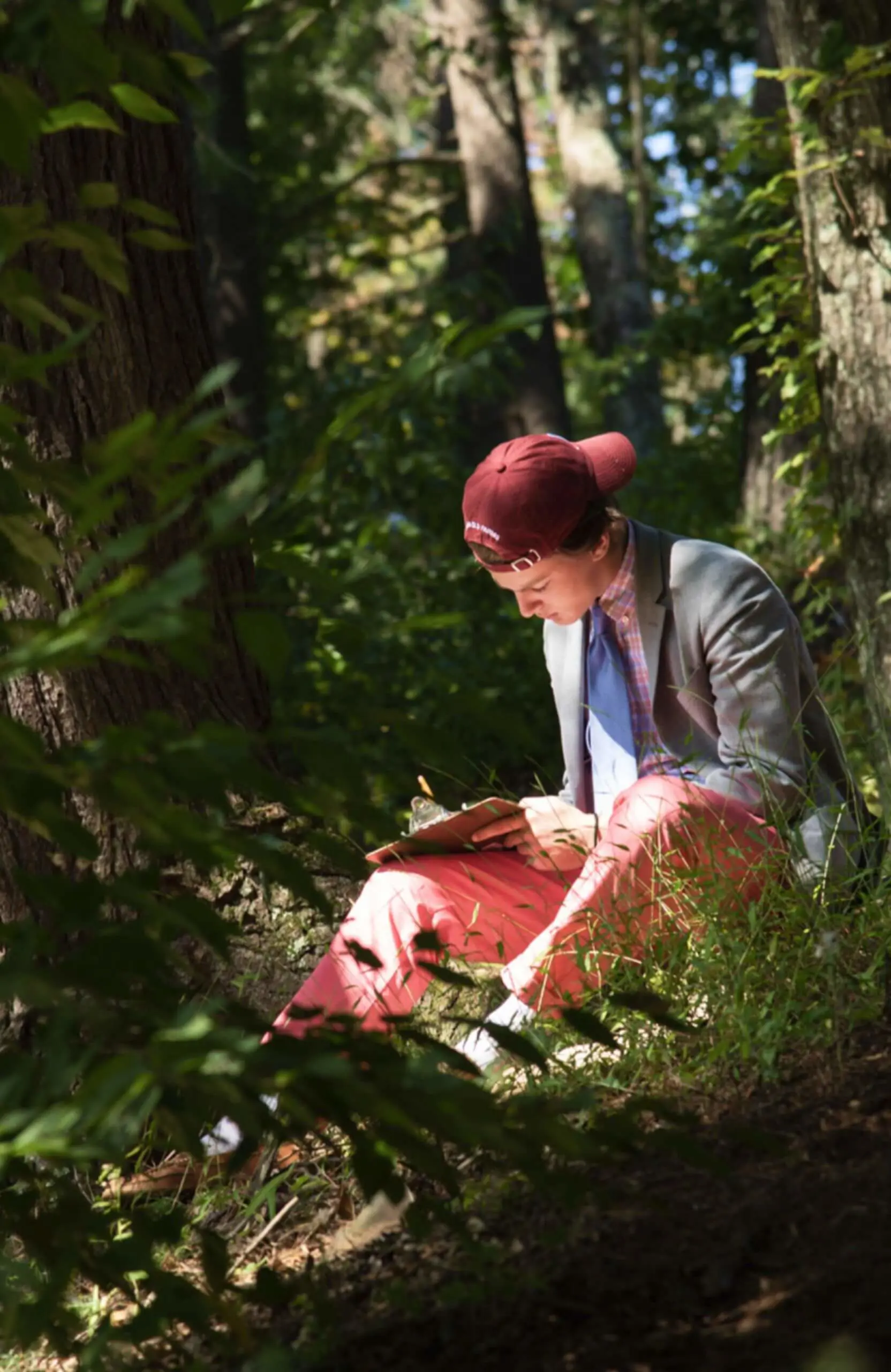 Avon Old Farms student drawing en plein air in the woods