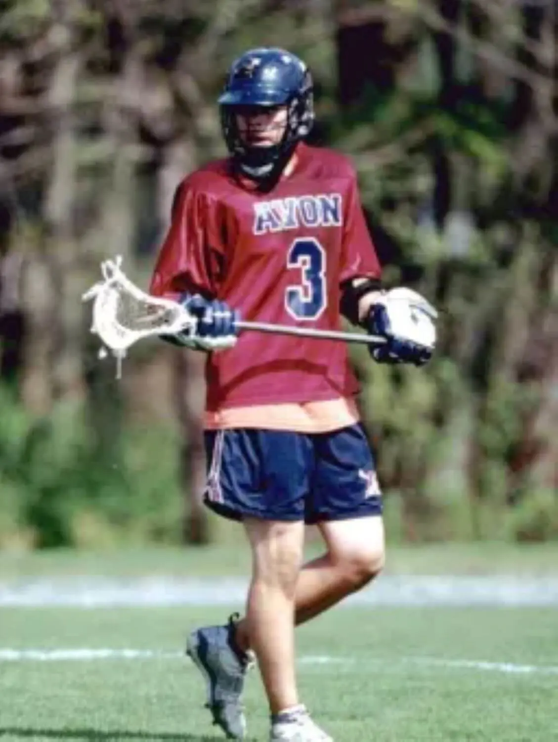 Avon Old Farms student playing Lacrosse.