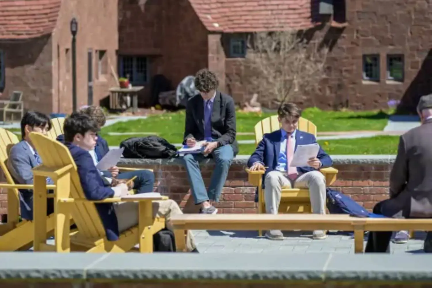 Avon Old Farms students reading and studying on the Peter A. Aron ’65 Memorial Patio