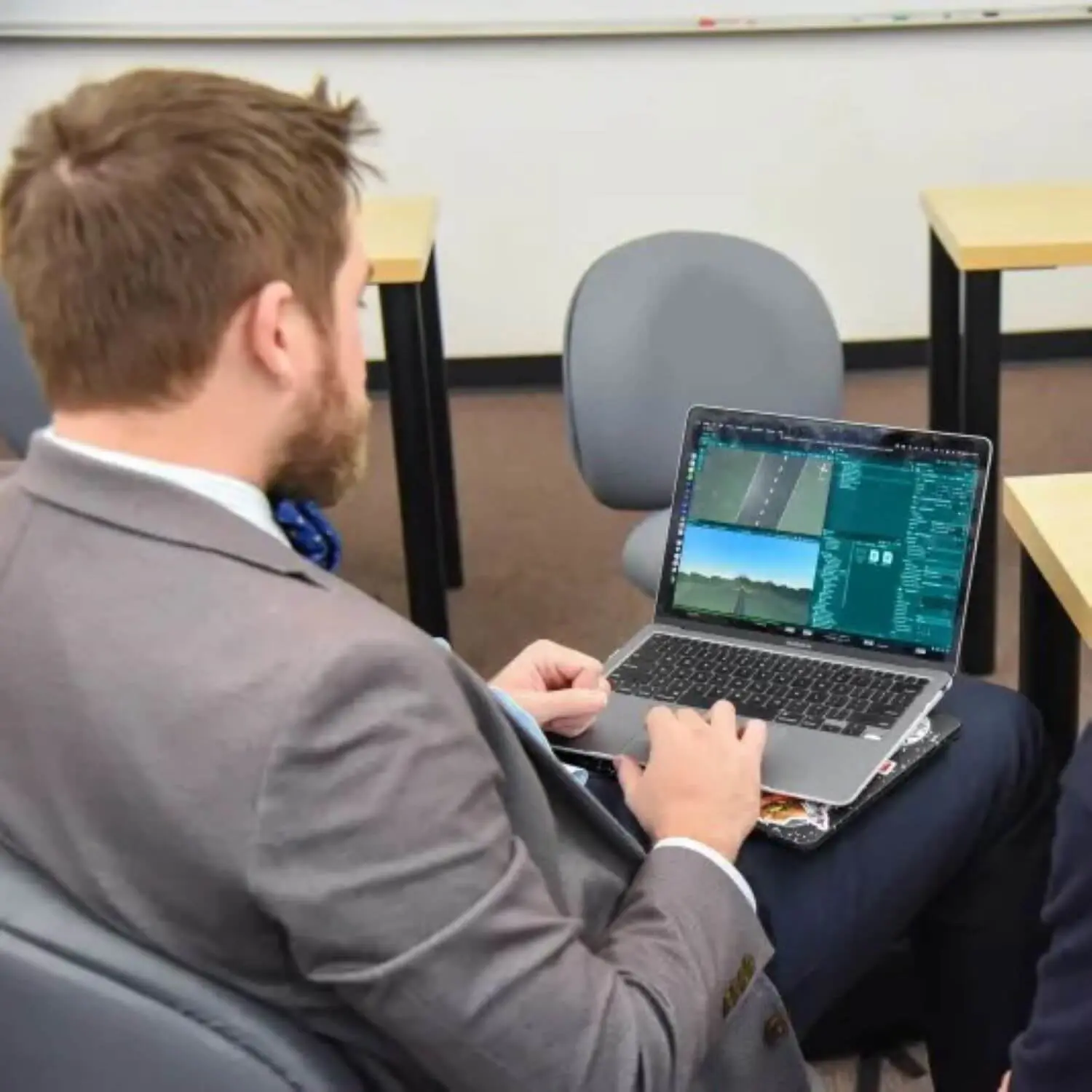 Avon Old Farms student and teacher using a laptop.