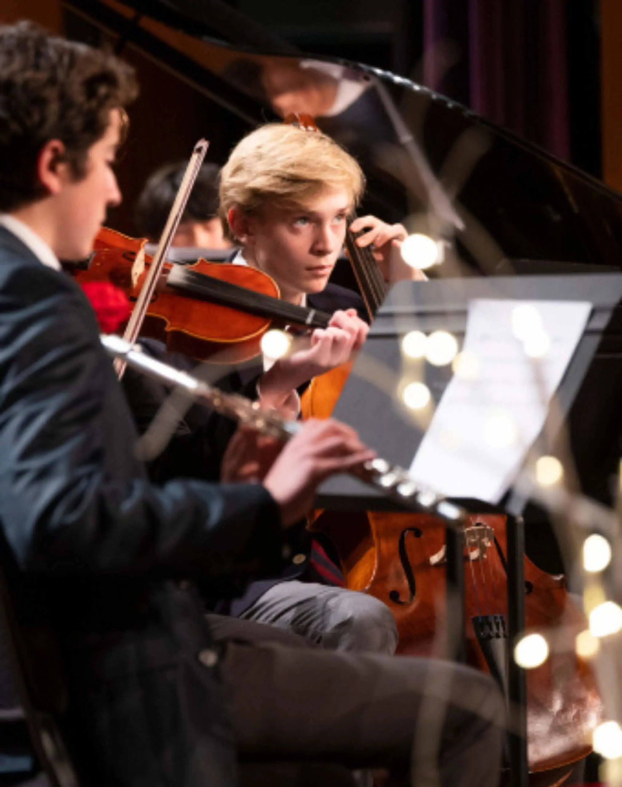 Avon Old Farms students playing string instruments at a concert