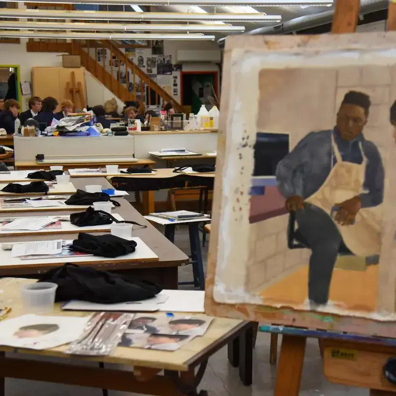 Avon Old Farms visual arts classroom with student painting in foreground