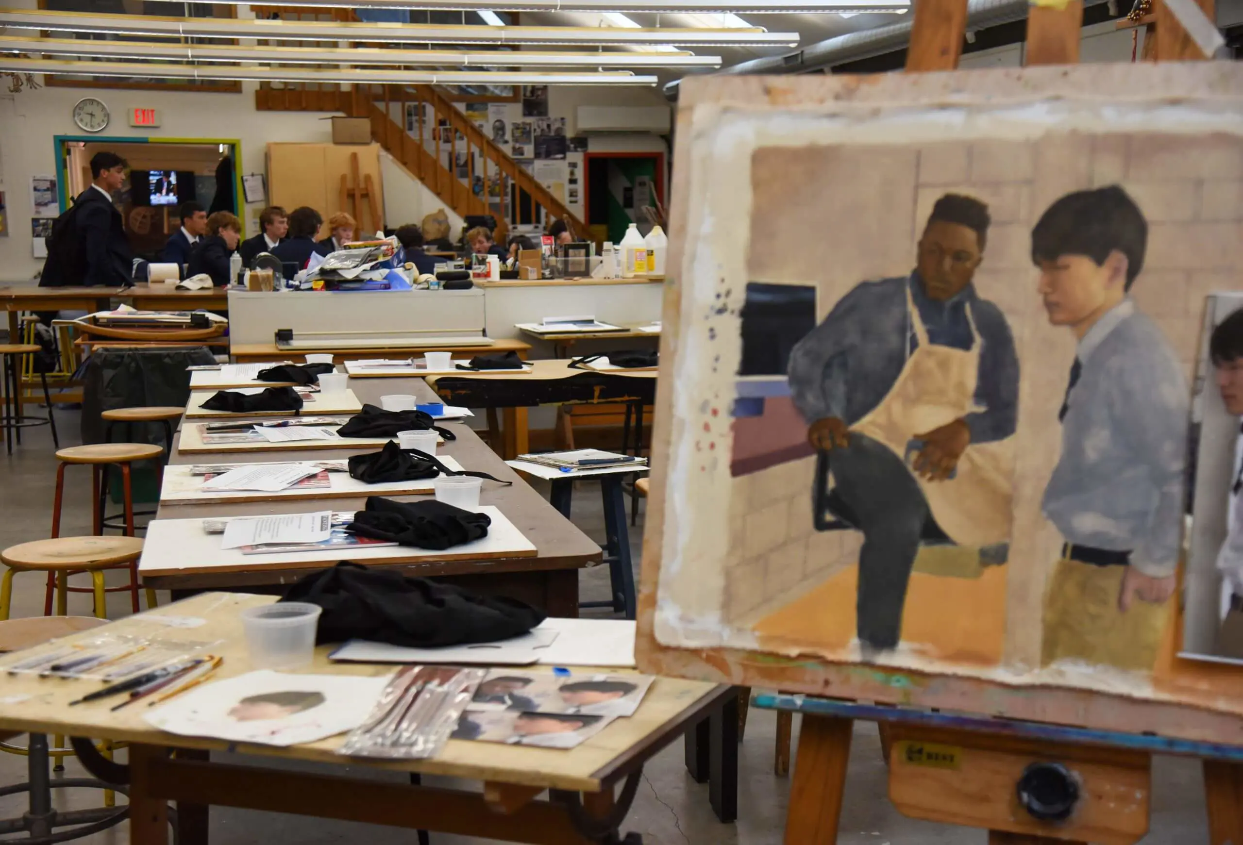 Avon Old Farms visual arts classroom with student painting in foreground