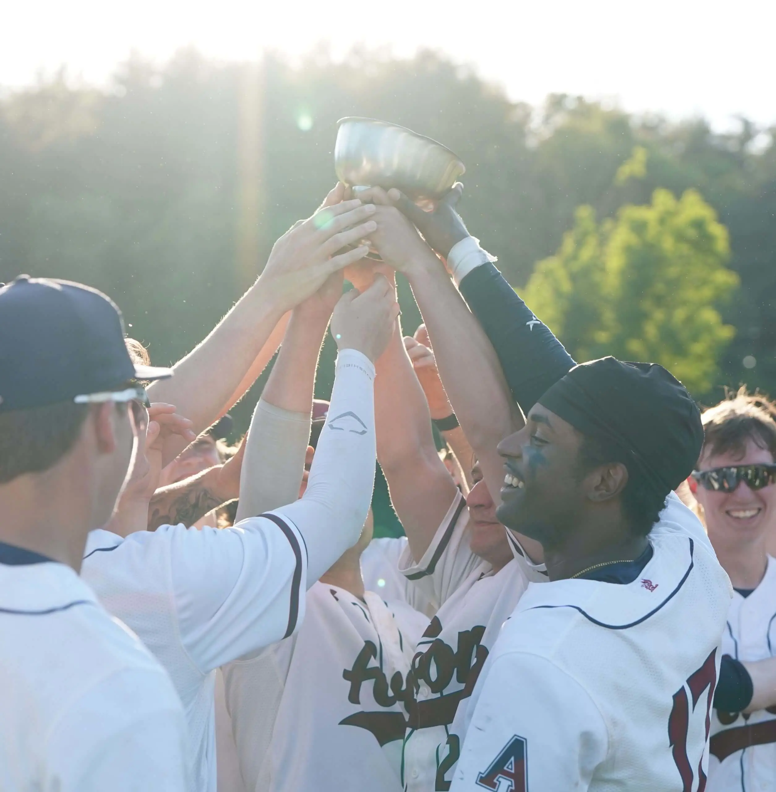 Avon Old Farms Baseball champions holding trophy aloft