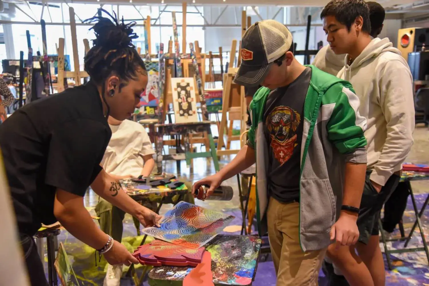 Avon Old Farms students working on a collaborative art project at Artists For Humanity (AFH).