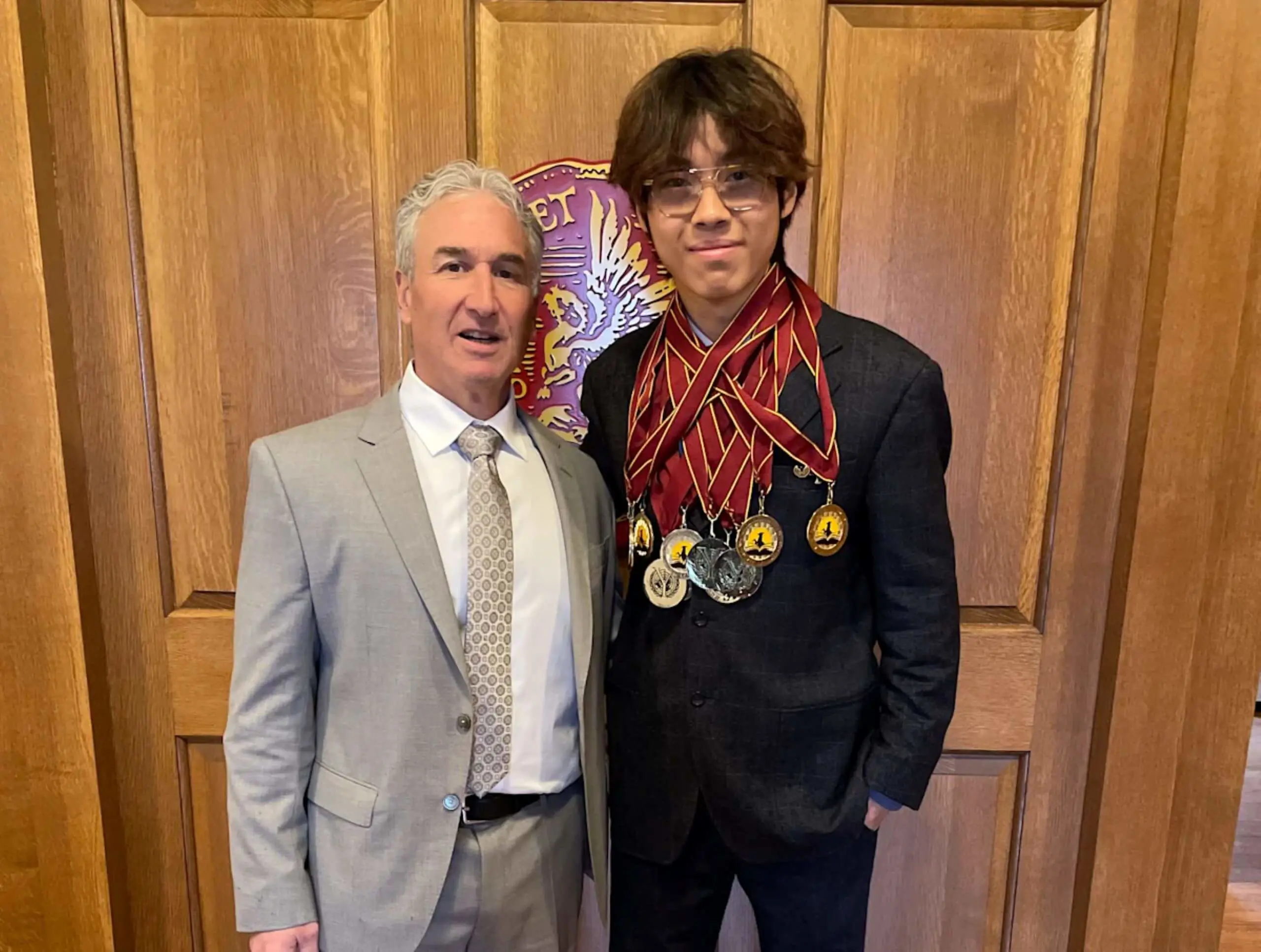 AOF Sophomore Xiran “Felix” Fan with World Scholar’s Cup (WSC) awards.