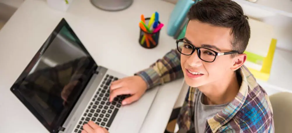 Student working on laptop.