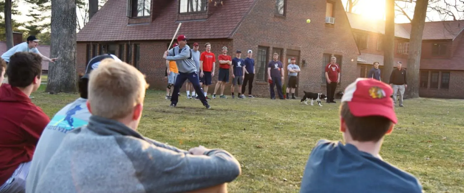 Avon Old Farms teachers and students playing Stickball.