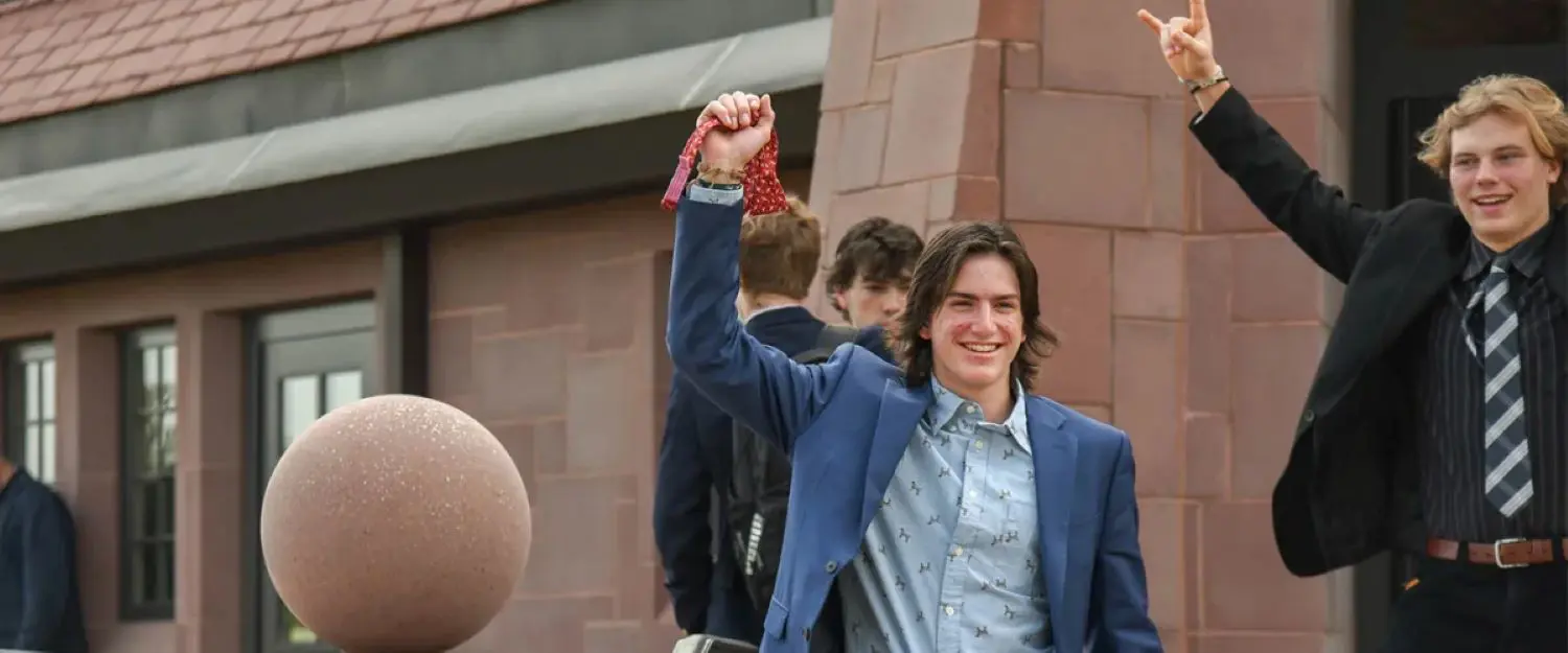 Avon Old Farms students taking off ties for Founder's Day.