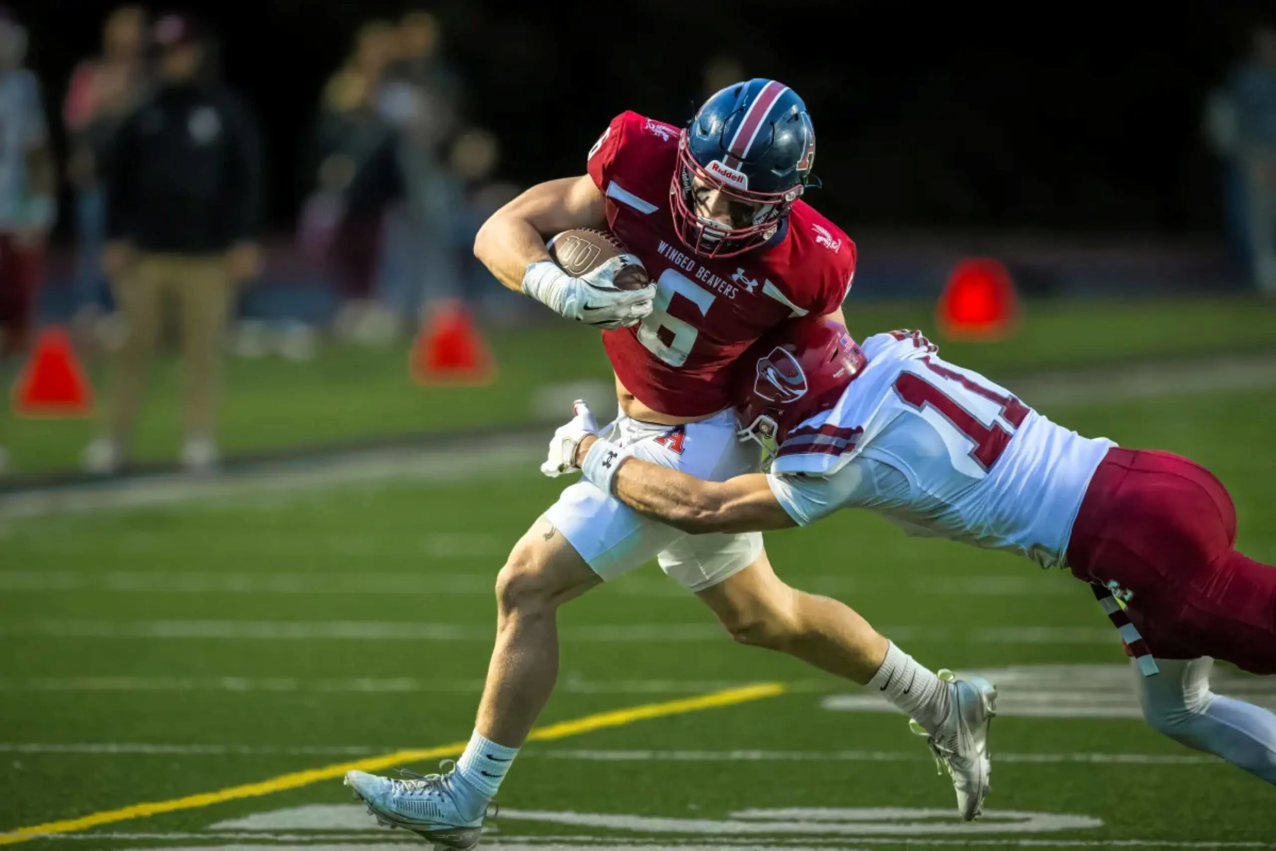 Owen Moreland ’25, one of three captains on the Varsity Football team, playing in a game.