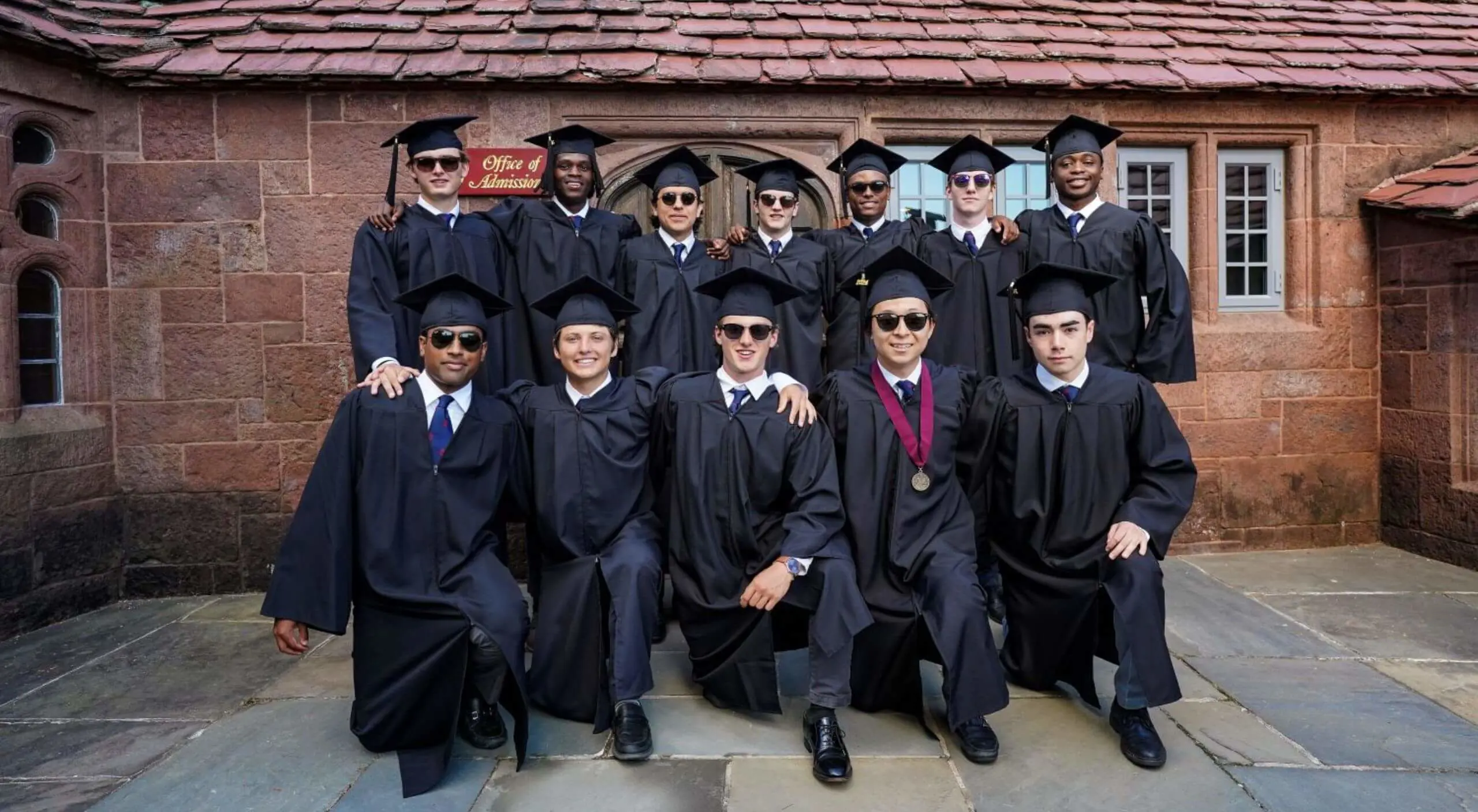 Avon Old Farms Students in graduation caps and gowns.