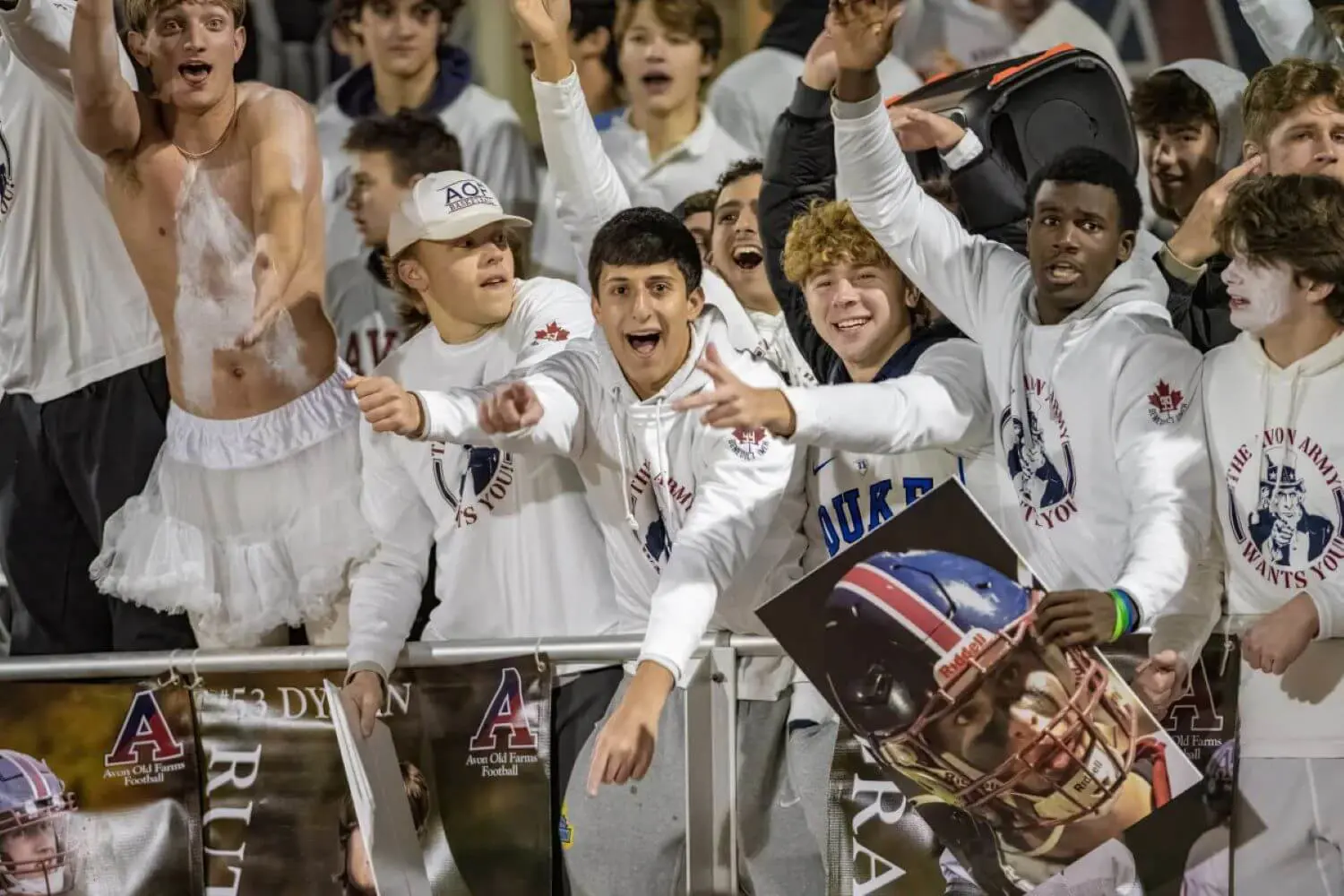 Students cheering at Avon Old Farms athletics event.