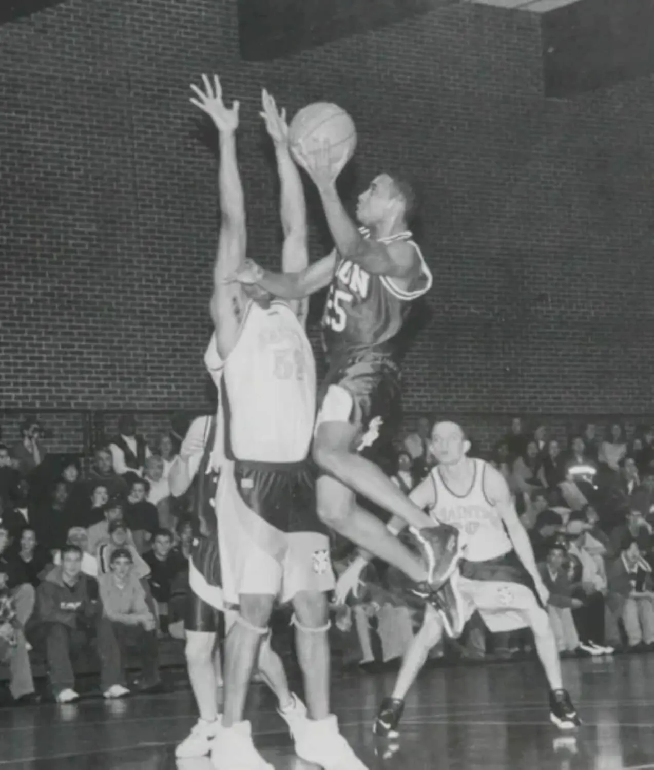 James W. Jennings ’99 playing basketball while a student at Avon Old Farms.