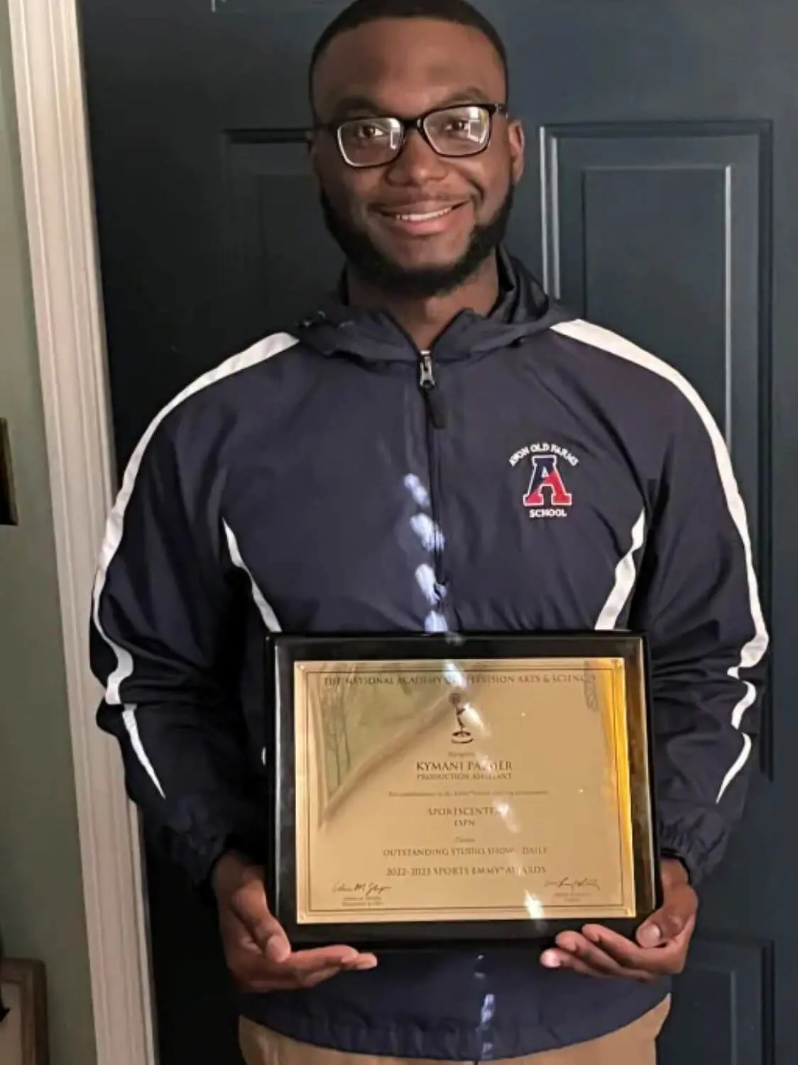 Kymani Palmer ’17 with Emmy Award.