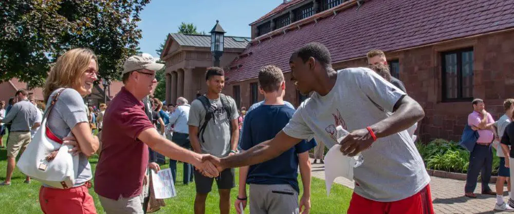 Avon Old Farms student welcoming new parents to the school.