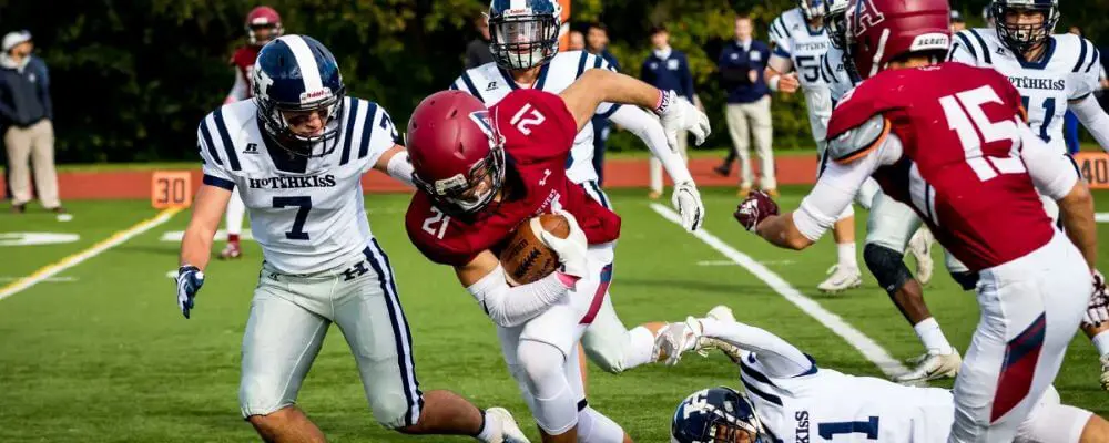 Avon Old Farms students playing football.