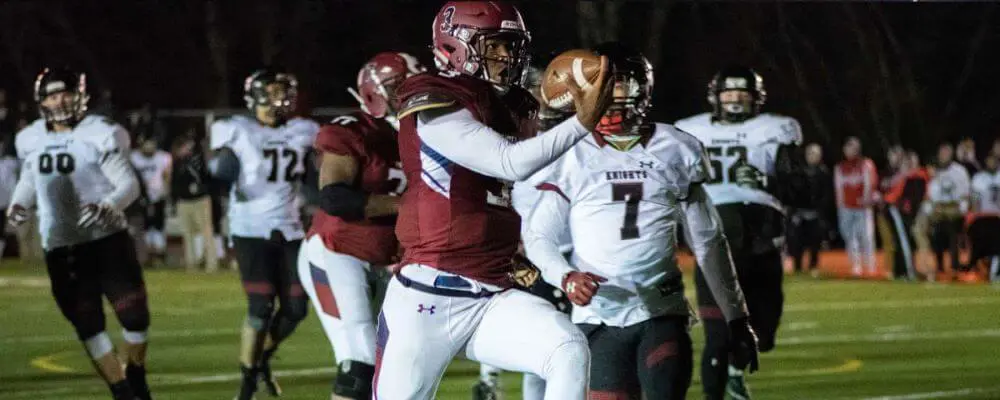 Avon Old Farms students playing football.