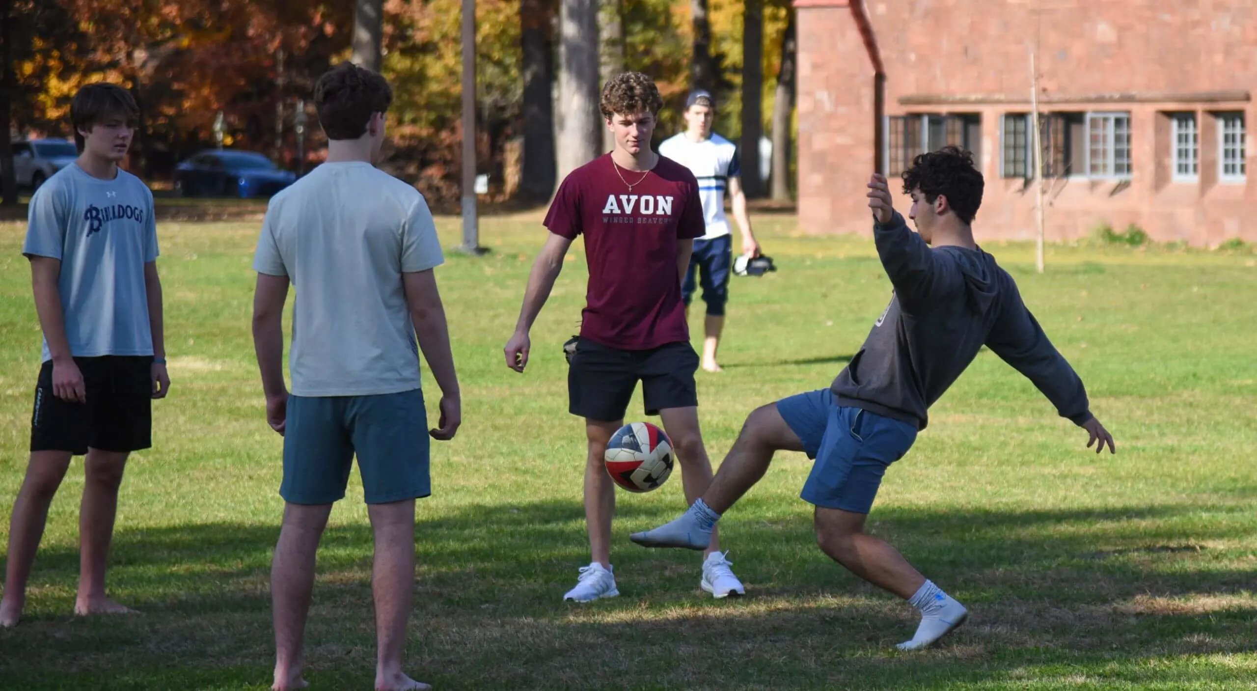 Avon Old Farms students playing a friendly game of soccer on campus.