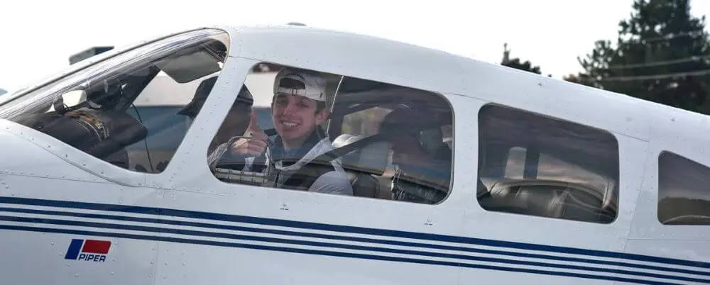 Avon Old Farms student in an airplane.