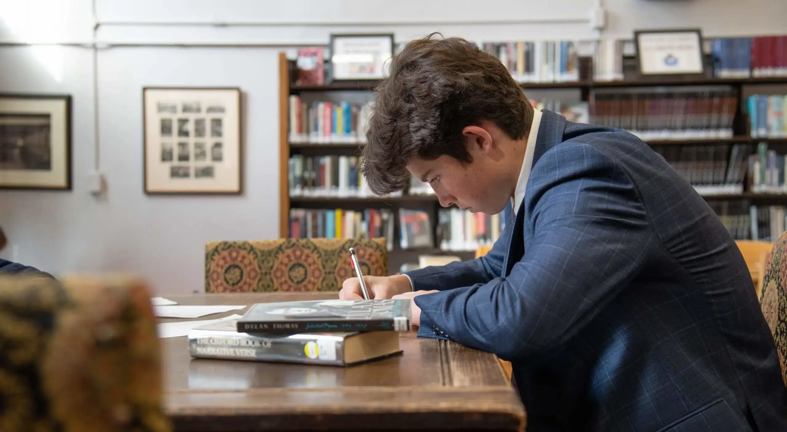 Avon Old Farms student studying in the Library.
