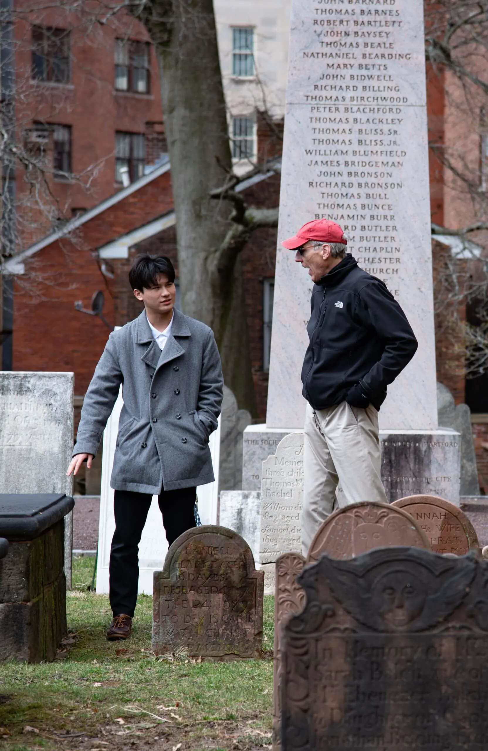 Avon Old Farms student and teacher on a field trip to the Hartford Graveyard
