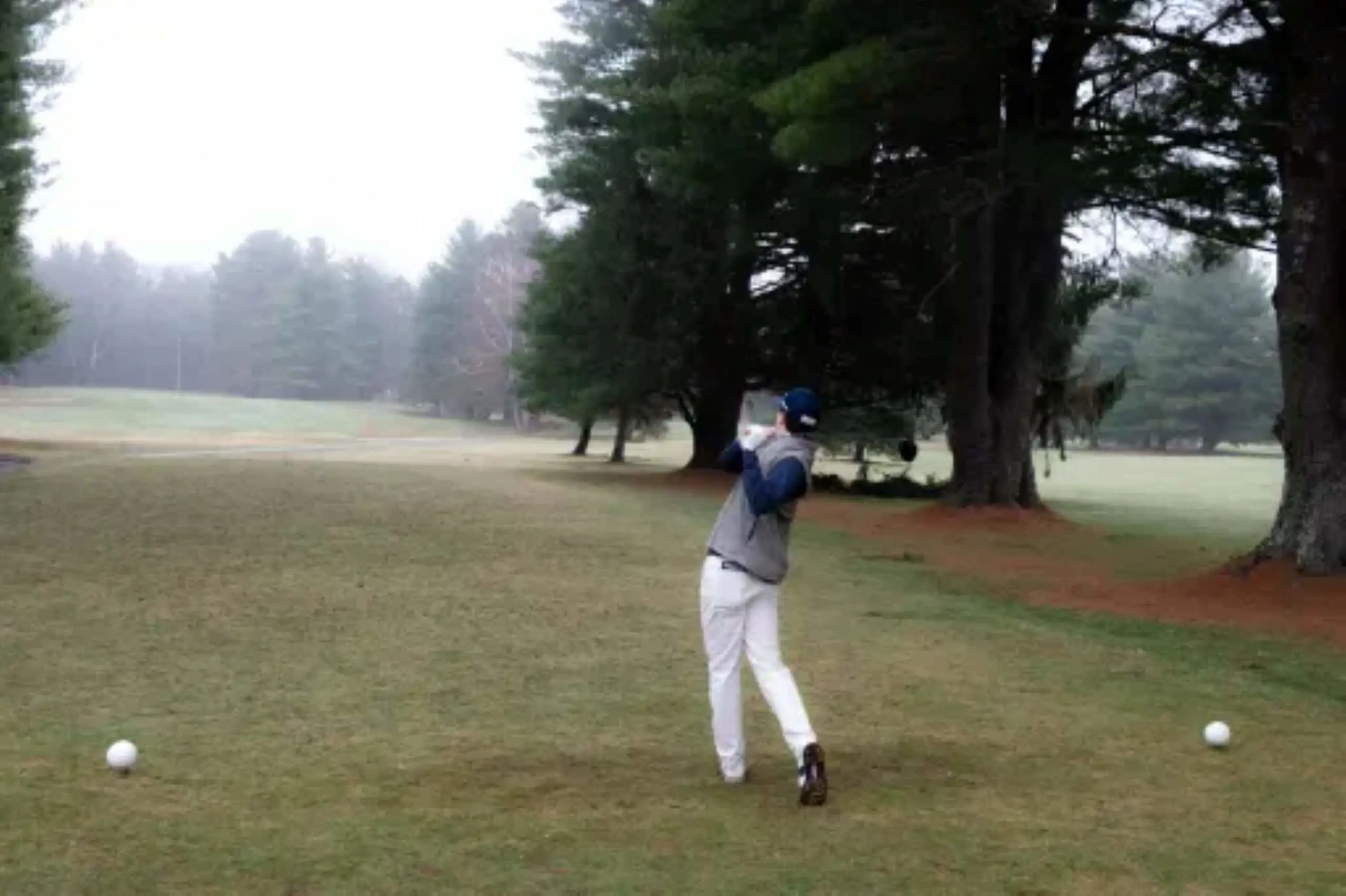 Avon Old Farms student playing golf.