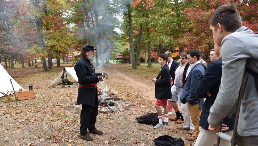 Avon Old Farms students having an outdoor History class on the American Civil War led by History teacher Arthur Custer.