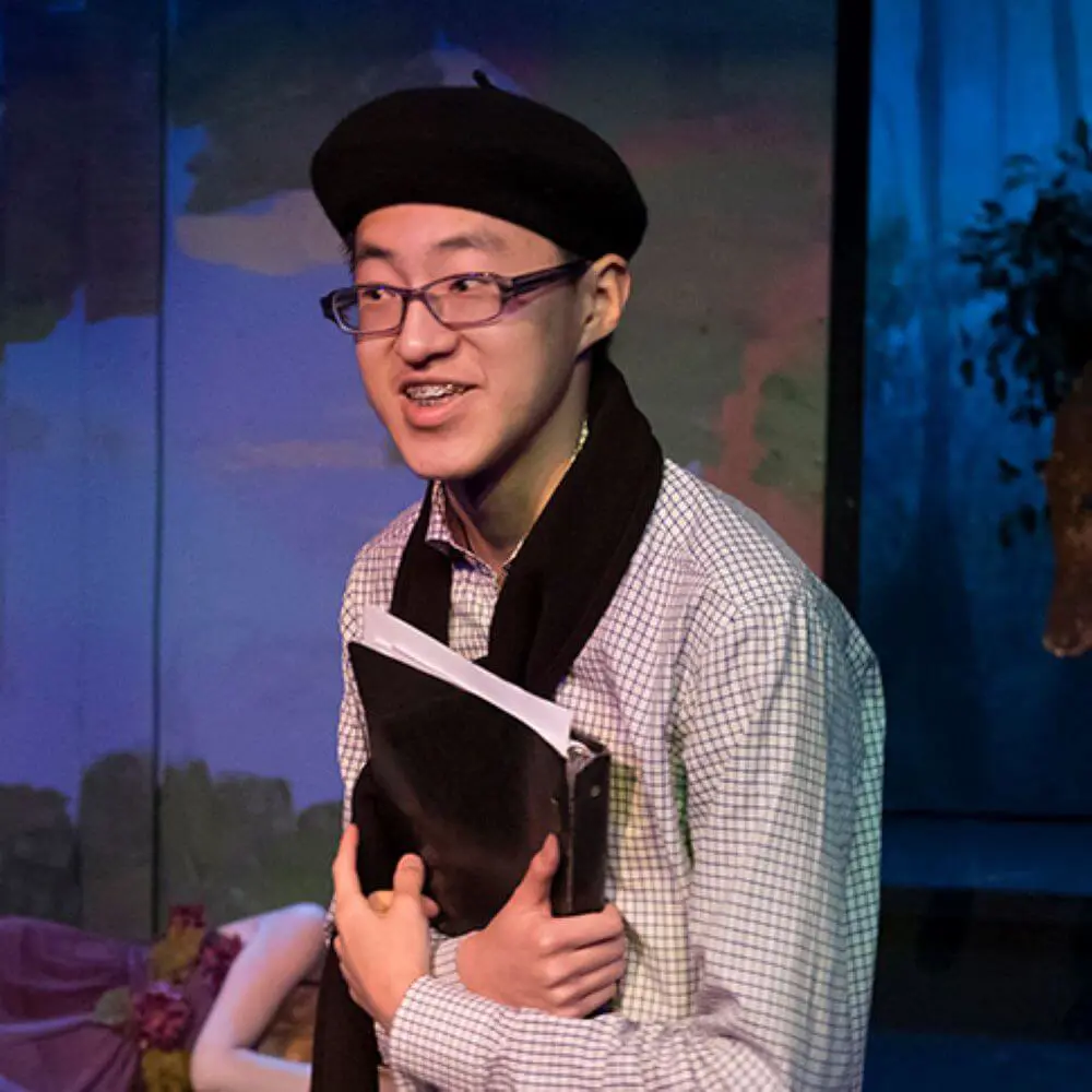 S.P. acting in theater.