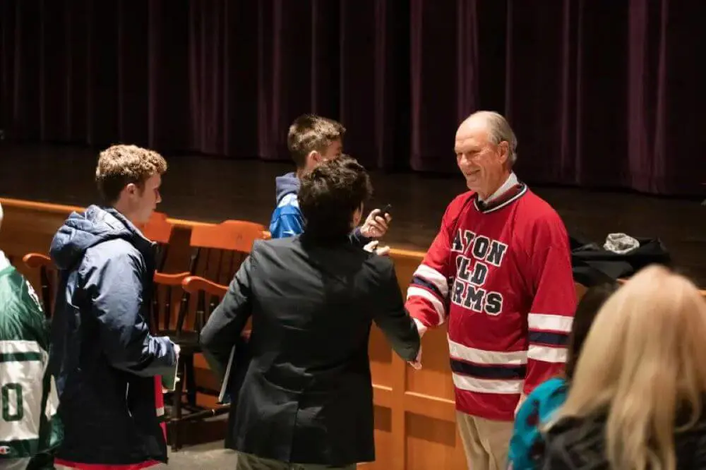 Visiting author Dr. Robert D. Ballard shaking hands with AOF students.