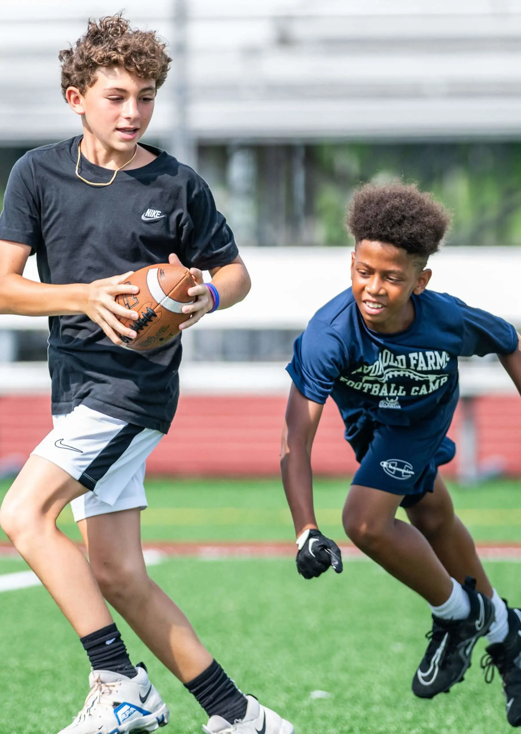 Avon Old Farms Football Camp attendees playing football.