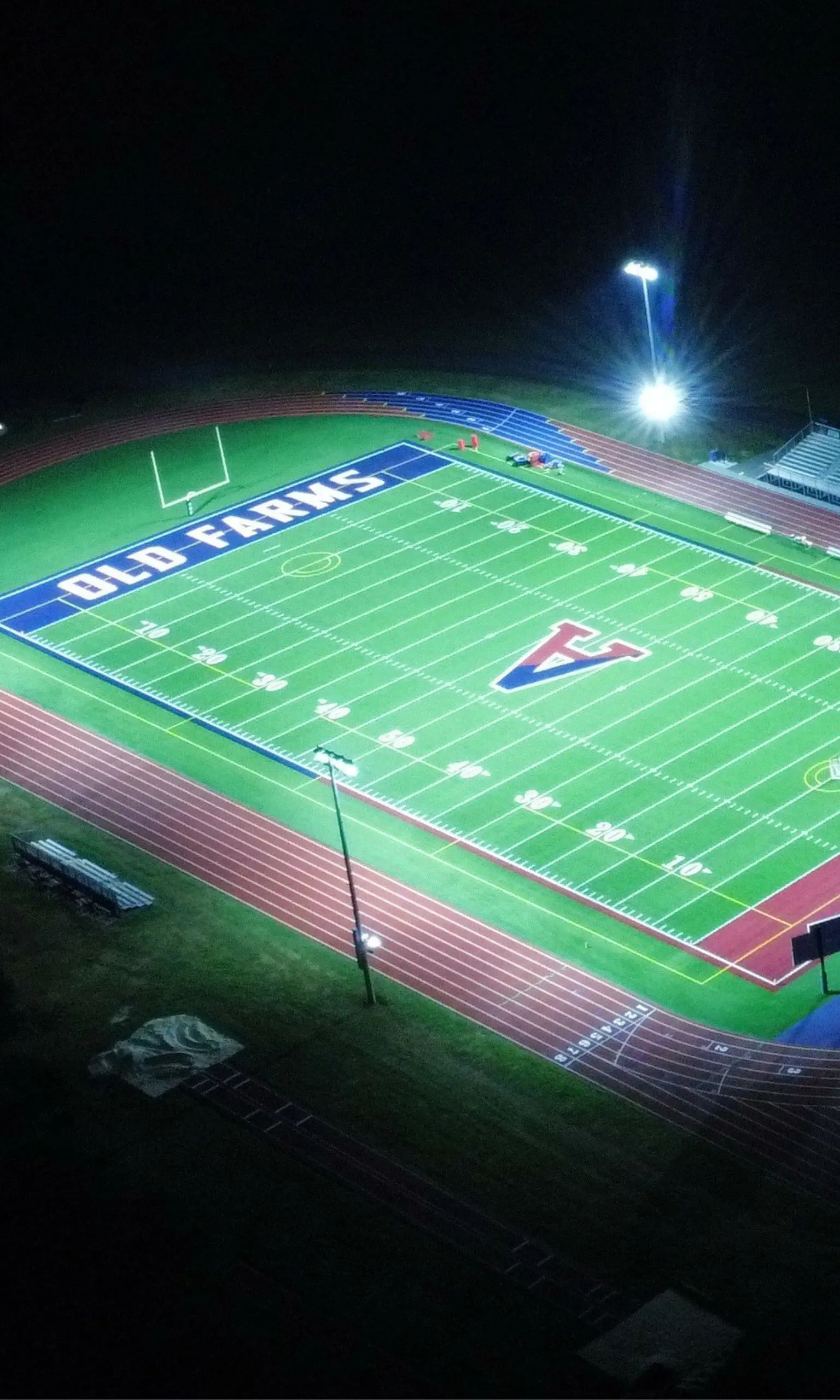 Avon Old Farms football field at night aerial photograph