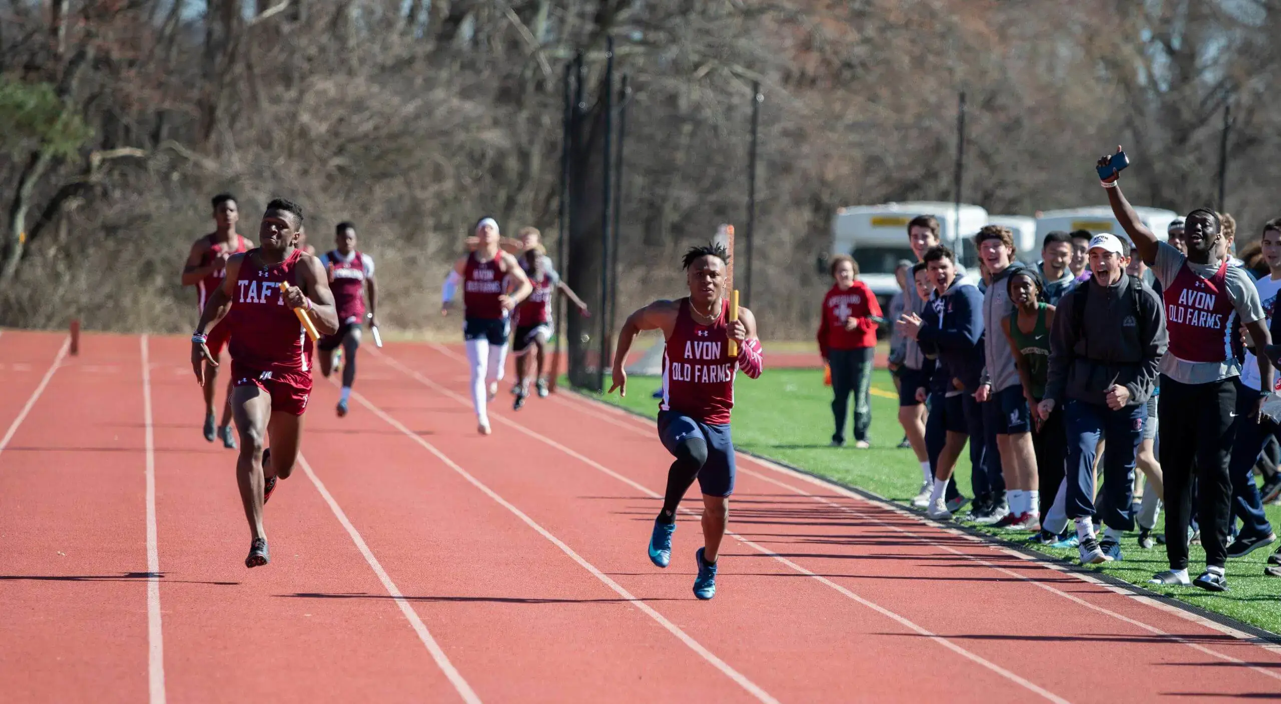 Avon Old Farms students sprinting around track