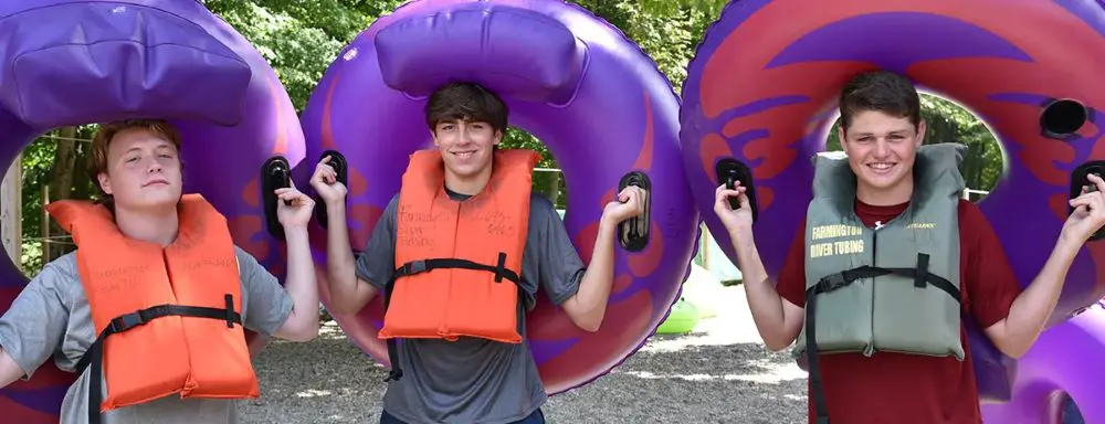 Avon Old Farms students with pool floats.