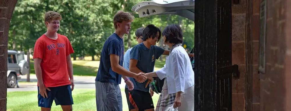 Avon Old Farms greeting new boarding student and family.