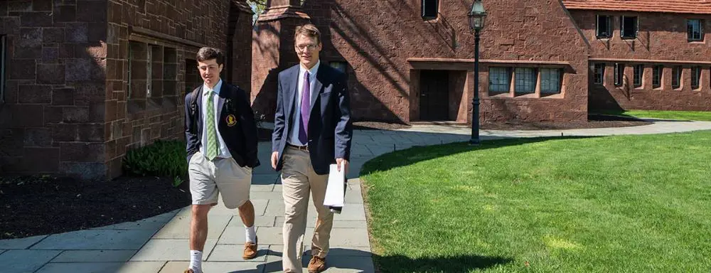Avon Old Farms teacher and student walking