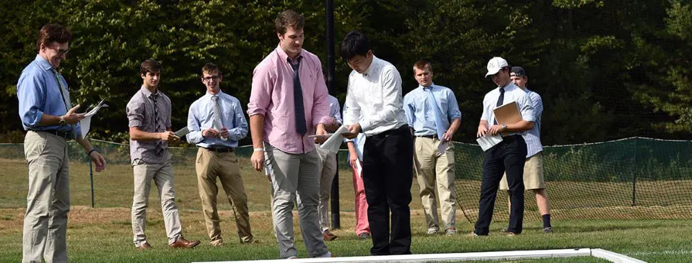 Avon Old Farms students and teacher in an outdoor class.
