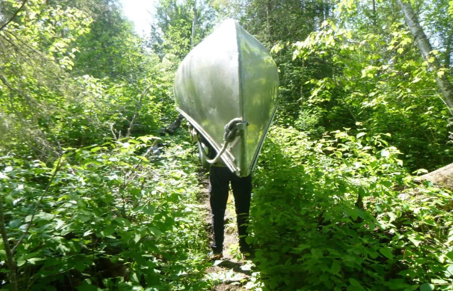 Michael Mounsey ’26 carrying a canoe.