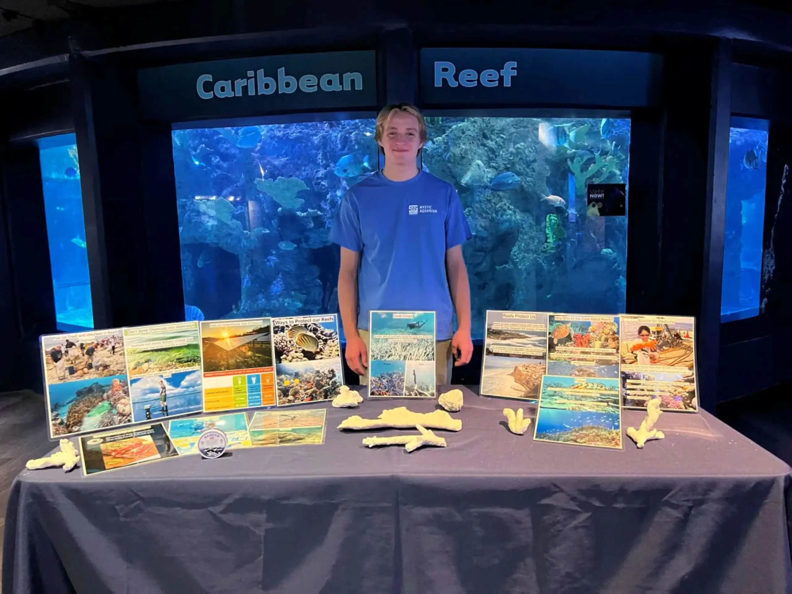 Dominik Sedlak-Braude ’25 with his AIP project display at Mystic Aquarium